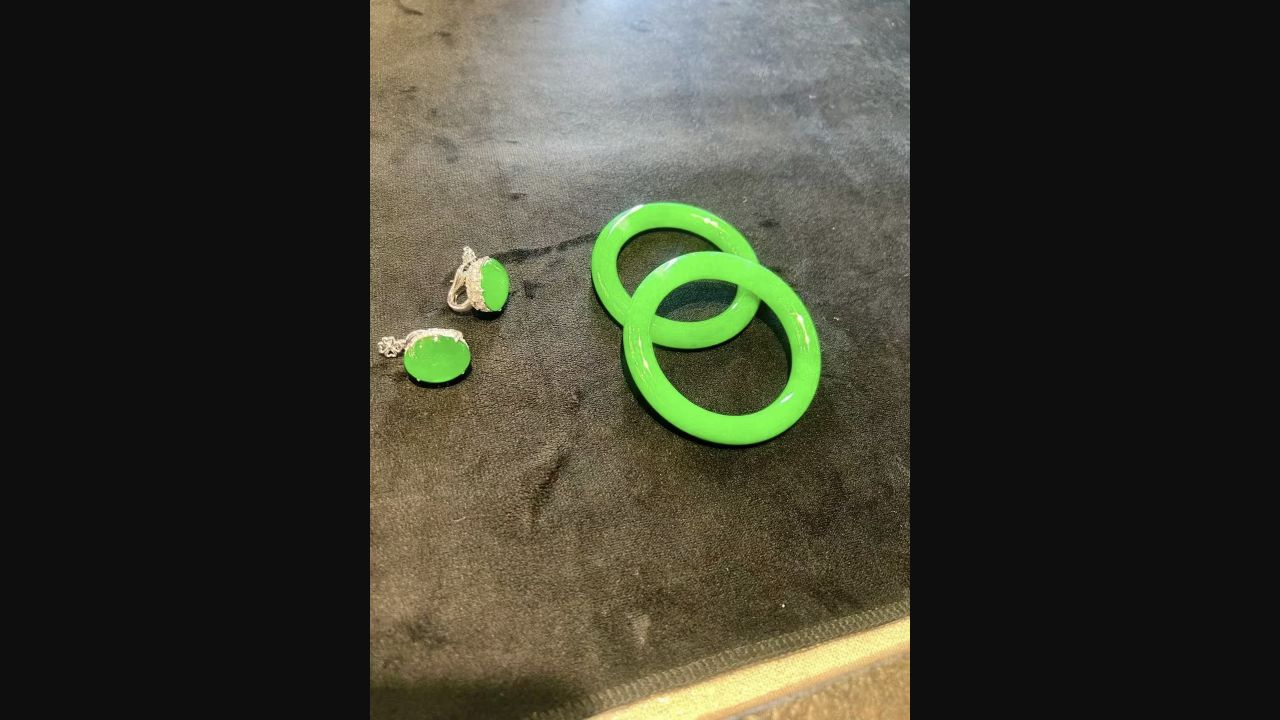 Vivid green jadeite bangle and pendant set
